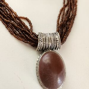 Brown multi-strand w/ earrings.